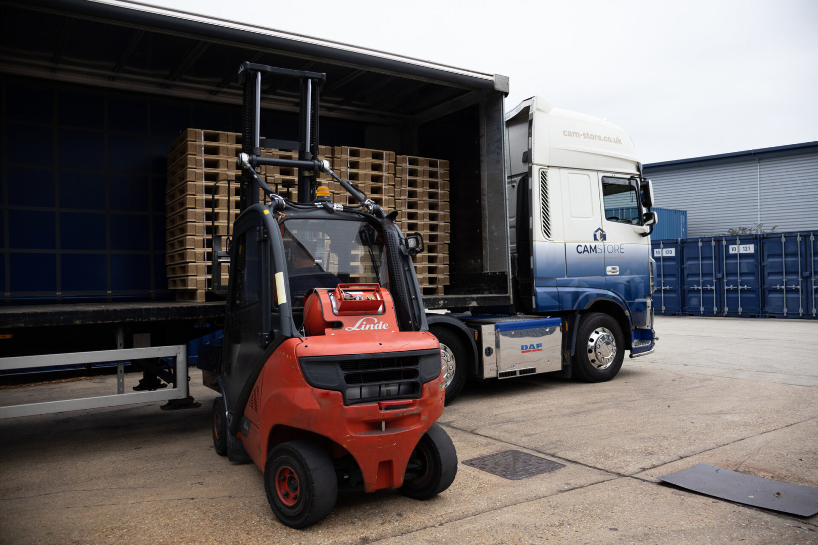 Pitch Fork Truck loading products into Lorry
